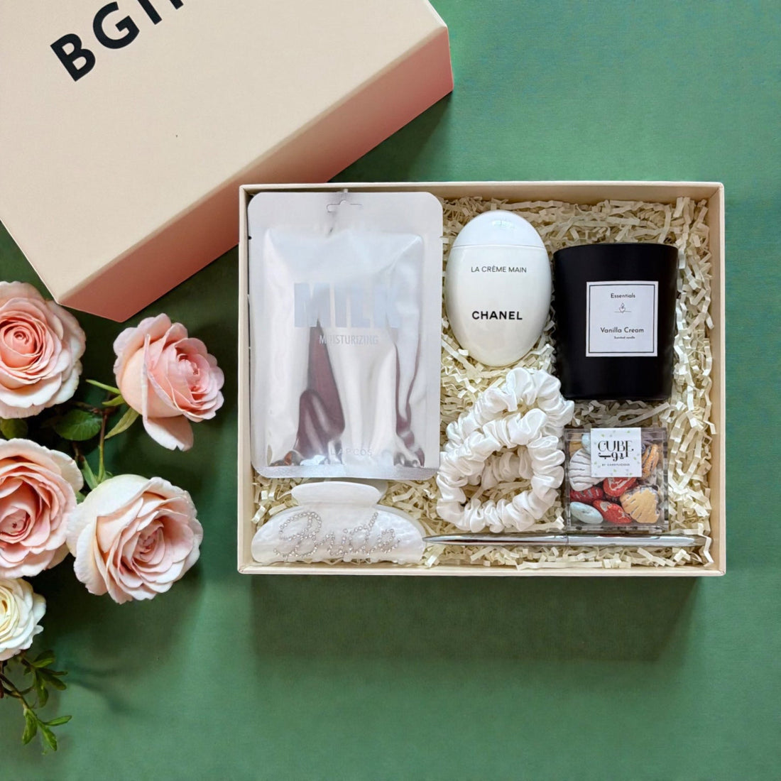 A bridal gift box with hand cream, silk scrunchies and a scented candle