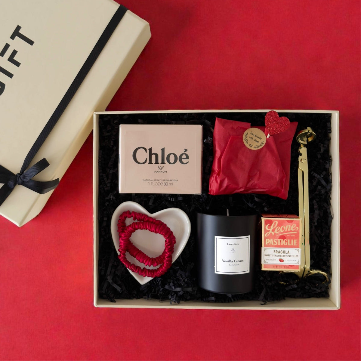 BGIFT luxury gift set featuring Chloé perfume, vanilla candle, gold trimmer, heart ring plate, and silk scrunchies.